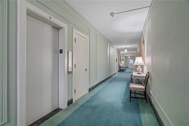 4618 Warwick Blvd Unit 6C, Kansas City, MO 64112 - hallway with carpet and elevator