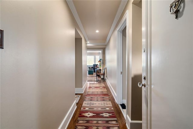 4618 Warwick Blvd Unit 6C, Kansas City, MO 64112 - hallway with ornamental molding, baseboards, and dark wood finished floors