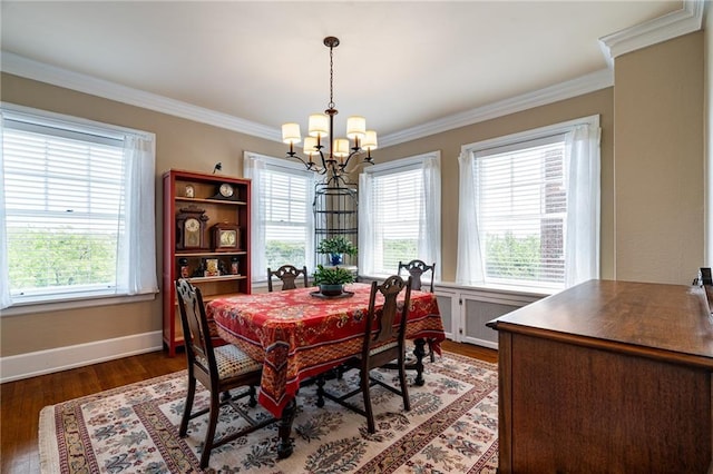 4618 Warwick Blvd Unit 6C, Kansas City, MO 64112 - dining room featuring a chandelier, healthy amount of natural light, crown molding, dark wood-style floors, and baseboards