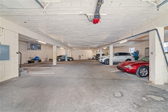 4618 Warwick Blvd Unit 6C, Kansas City, MO 64112 - parking deck featuring electric panel and a garage door opener