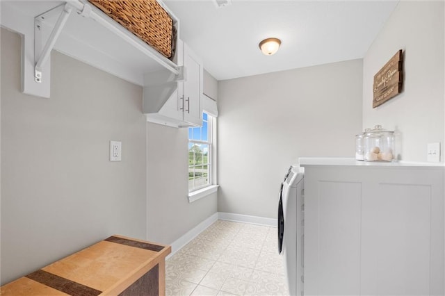 20711 W 49th St, Shawnee, KS 66218 - laundry area featuring baseboards, cabinet space, and separate washer and dryer