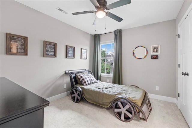 20711 W 49th St, Shawnee, KS 66218 - bedroom with light carpet, baseboards, and a ceiling fan