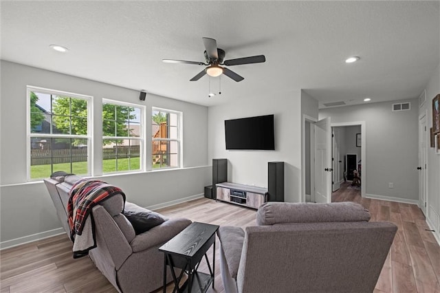 20711 W 49th St, Shawnee, KS 66218 - living room with healthy amount of natural light, ceiling fan, baseboards, light wood-style flooring, and recessed lighting