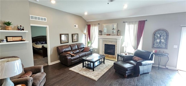 12432 Live Oak Cir, Peculiar, MO 64078 - living room featuring a glass covered fireplace, baseboards, wood finished floors, and lofted ceiling