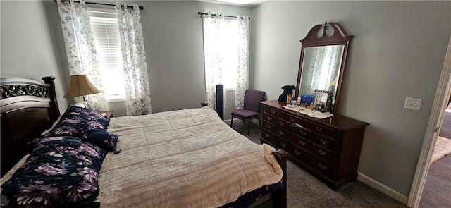 12432 Live Oak Cir, Peculiar, MO 64078 - carpeted bedroom featuring multiple windows and baseboards