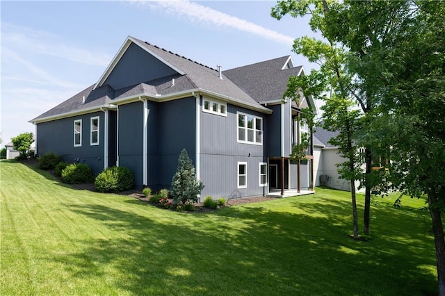 9291 Brownridge St, Lenexa, KS 66220 - view of side of property with a lawn