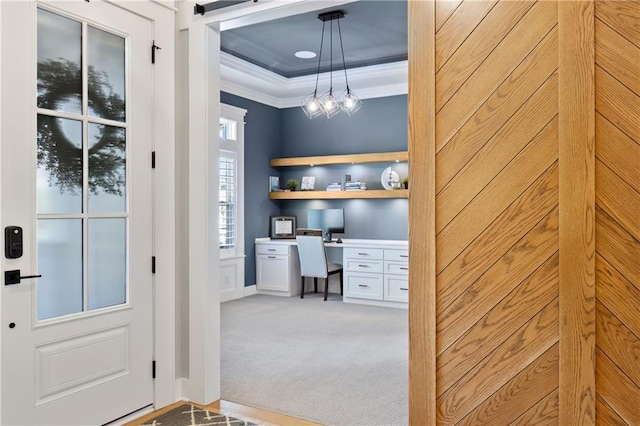 9291 Brownridge St, Lenexa, KS 66220 - office with crown molding, built in study area, light colored carpet, and a tray ceiling