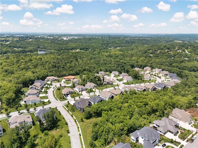 9291 Brownridge St, Lenexa, KS 66220 - aerial perspective of suburban area featuring a forest