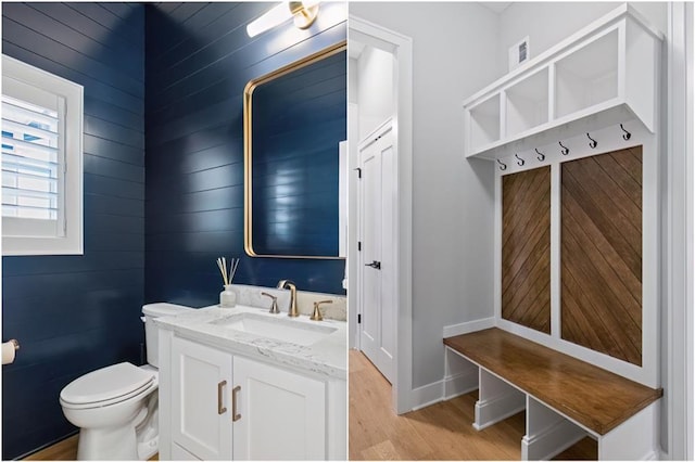 9291 Brownridge St, Lenexa, KS 66220 - bathroom featuring wood finished floors and vanity