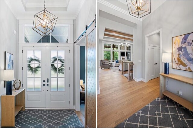 9291 Brownridge St, Lenexa, KS 66220 - foyer featuring a chandelier, french doors, wood finished floors, ornamental molding, and a towering ceiling