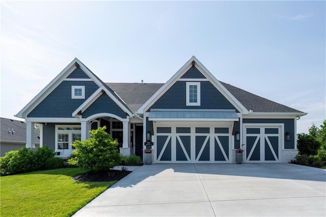 9291 Brownridge St, Lenexa, KS 66220 - craftsman house featuring a front yard, driveway, a garage, and roof with shingles