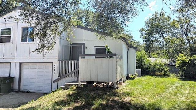8476 Lane Dr, Raytown, MO 64138 - view of front of house with a front lawn and an attached garage
