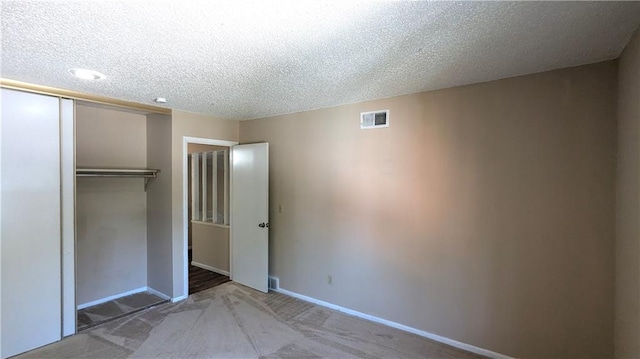 8476 Lane Dr, Raytown, MO 64138 - unfurnished bedroom with carpet floors, a closet, a textured ceiling, and recessed lighting