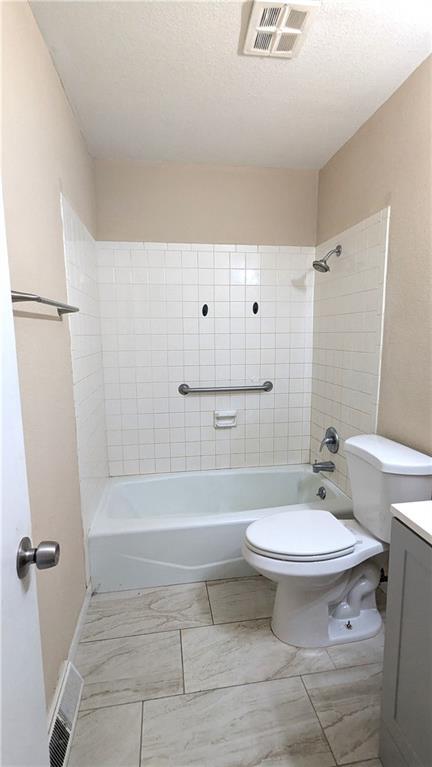 8476 Lane Dr, Raytown, MO 64138 - bathroom featuring vanity and shower / tub combination