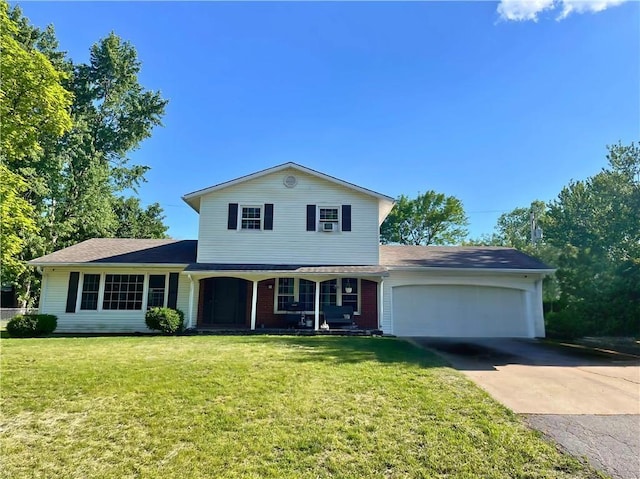 305 W 18th St, Holden, MO 64040 - traditional-style home featuring an attached garage, concrete driveway, and a front yard