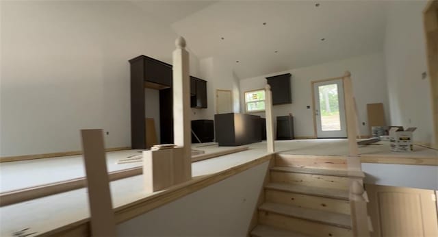 134 Cedar Cir, Warrensburg, MO 64093 - staircase featuring vaulted ceiling