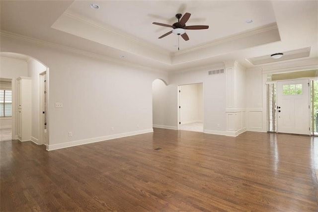 8558 Barstow St, Lenexa, KS 66219 - unfurnished room with arched walkways, a raised ceiling, ceiling fan, plenty of natural light, and ornamental molding