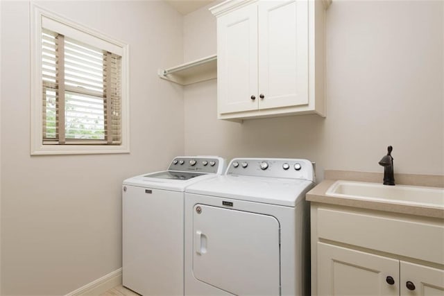 8558 Barstow St, Lenexa, KS 66219 - laundry room featuring cabinet space and washer and clothes dryer