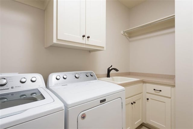 8558 Barstow St, Lenexa, KS 66219 - laundry area featuring washer and dryer and cabinet space