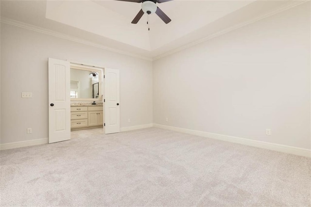 8558 Barstow St, Lenexa, KS 66219 - unfurnished bedroom featuring ornamental molding, light carpet, a raised ceiling, connected bathroom, and a ceiling fan