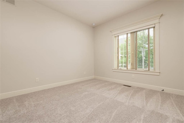 8558 Barstow St, Lenexa, KS 66219 - spare room with baseboards and carpet