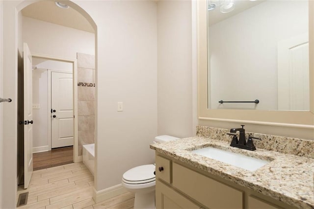 8558 Barstow St, Lenexa, KS 66219 - full bathroom with vanity, wood finish floors, and shower / bath combination