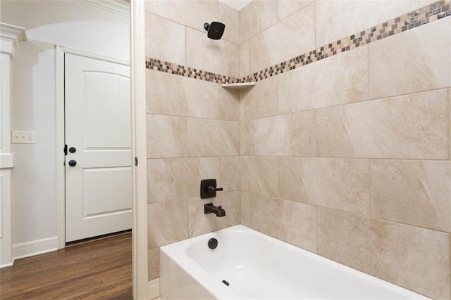 8558 Barstow St, Lenexa, KS 66219 - full bath featuring wood finished floors and bathtub / shower combination