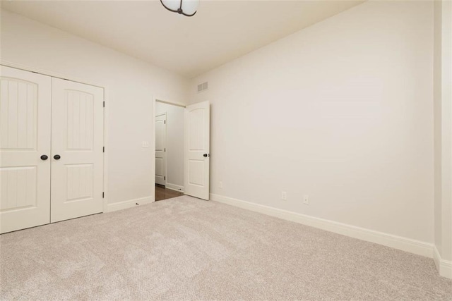 8558 Barstow St, Lenexa, KS 66219 - unfurnished bedroom featuring carpet flooring and a closet