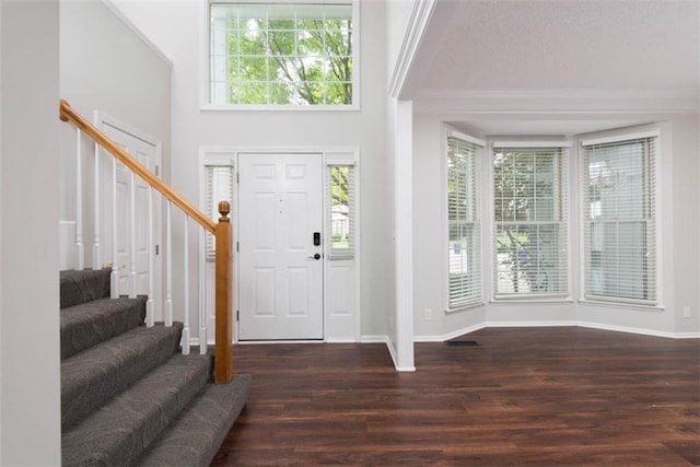 16533 W 80th St, Lenexa, KS 66219 - foyer entrance featuring stairway, crown molding, wood finished floors, healthy amount of natural light, and a textured ceiling