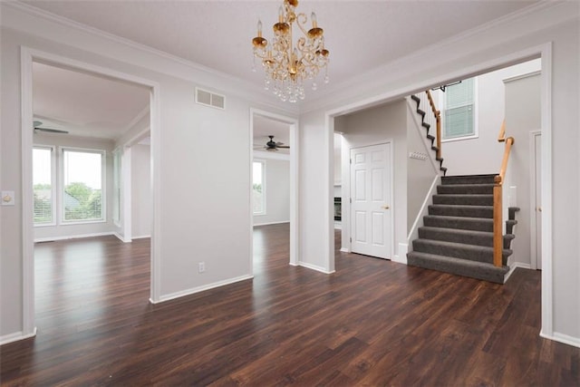 16533 W 80th St, Lenexa, KS 66219 - unfurnished living room with stairway, ceiling fan, a chandelier, dark wood finished floors, and ornamental molding