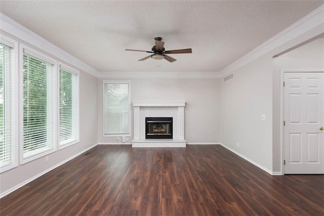 16533 W 80th St, Lenexa, KS 66219 - unfurnished living room featuring a ceiling fan, dark wood-type flooring, crown molding, a textured ceiling, and a fireplace with raised hearth