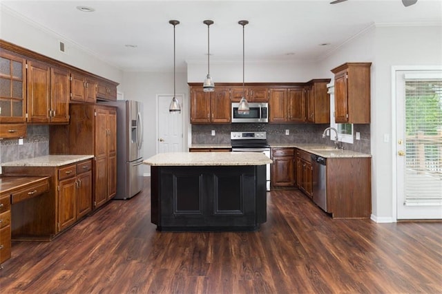 16533 W 80th St, Lenexa, KS 66219 - kitchen featuring appliances with stainless steel finishes, a kitchen island, dark wood-style floors, tasteful backsplash, and crown molding