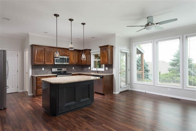 16533 W 80th St, Lenexa, KS 66219 - kitchen featuring appliances with stainless steel finishes, a ceiling fan, a kitchen island, dark wood-style floors, and backsplash