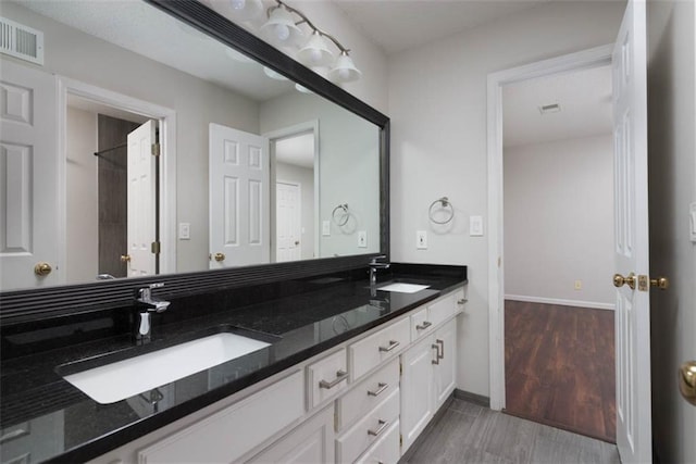 16533 W 80th St, Lenexa, KS 66219 - full bath featuring double vanity and wood finished floors