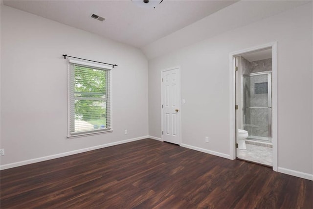16533 W 80th St, Lenexa, KS 66219 - unfurnished bedroom featuring dark wood finished floors, ensuite bath, and lofted ceiling