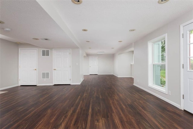16533 W 80th St, Lenexa, KS 66219 - unfurnished living room featuring wood finished floors and a textured ceiling