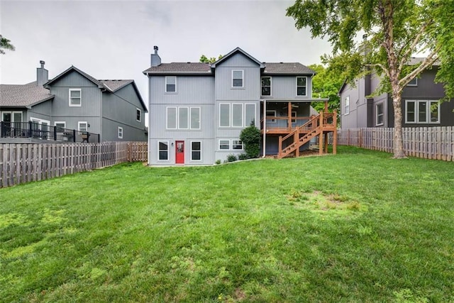 16533 W 80th St, Lenexa, KS 66219 - rear view of house with a fenced backyard, stairway, a wooden deck, and a chimney