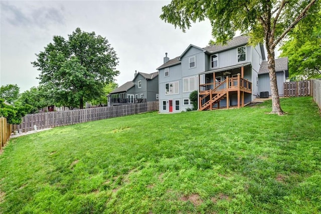 16533 W 80th St, Lenexa, KS 66219 - back of house with stairway, a fenced backyard, a wooden deck, and a shingled roof