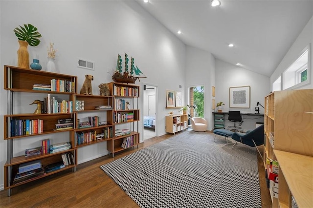 2711 W 49th St, Westwood, KS 66205 - sitting room with wood finished floors, recessed lighting, and high vaulted ceiling