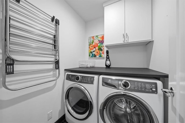2711 W 49th St, Westwood, KS 66205 - laundry area featuring cabinet space and independent washer and dryer