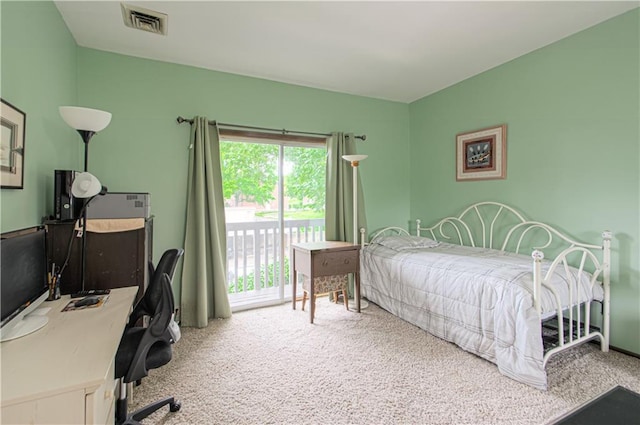 445 W 104th St Unit C, Kansas City, MO 64114 - carpeted bedroom featuring an office area and access to exterior