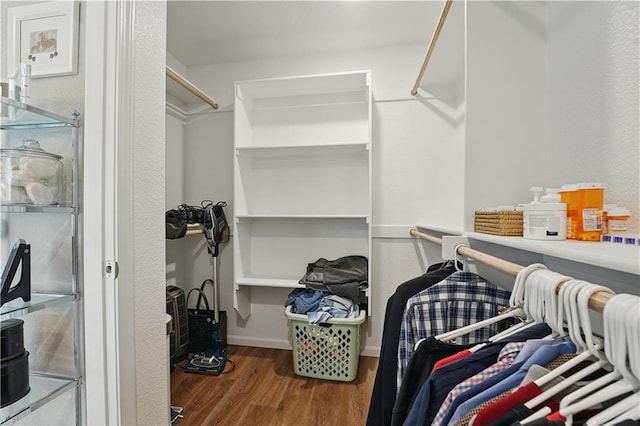 7546 Mccormick Dr, Shawnee, KS 66227 - walk in closet with wood finished floors