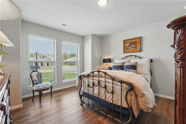 7546 Mccormick Dr, Shawnee, KS 66227 - bedroom with baseboards and dark wood-style floors