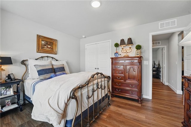 7546 Mccormick Dr, Shawnee, KS 66227 - bedroom featuring a closet and wood finished floors