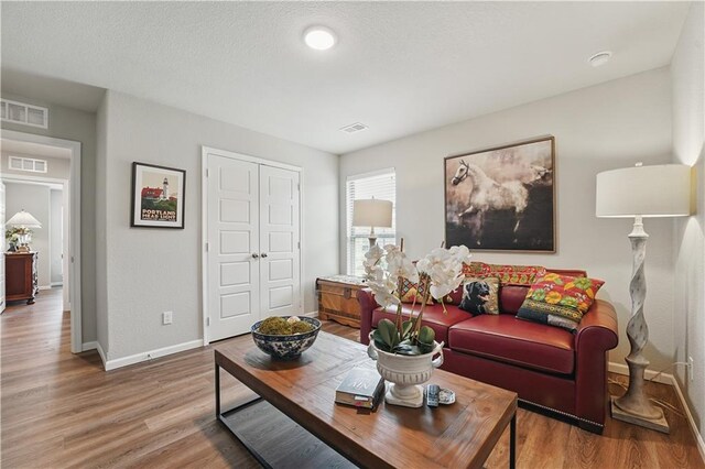 7546 Mccormick Dr, Shawnee, KS 66227 - living area with baseboards and wood finished floors