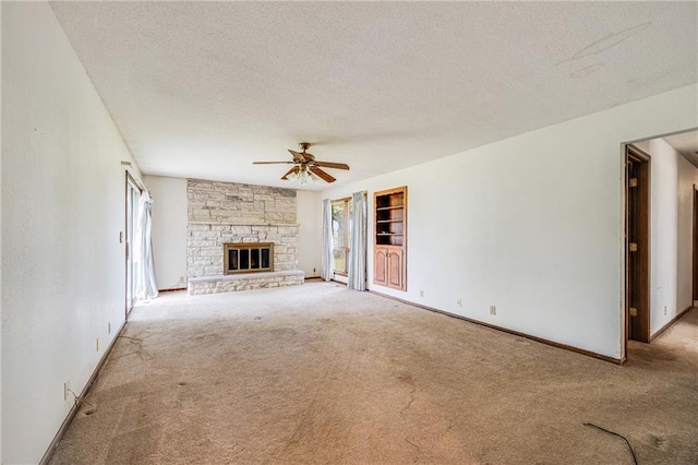 630 Oo Hwy, Centerview, MO 64019 - unfurnished living room with carpet flooring, a textured ceiling, ceiling fan, healthy amount of natural light, and baseboards