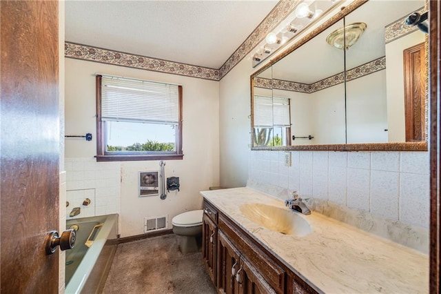 630 Oo Hwy, Centerview, MO 64019 - full bathroom featuring toilet, a garden tub, vanity, and backsplash