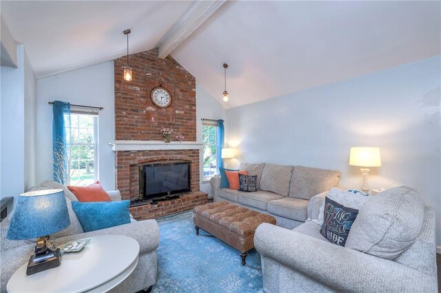 14001 S Tomahawk Dr, Olathe, KS 66062 - living room featuring beam ceiling, plenty of natural light, a fireplace, and high vaulted ceiling