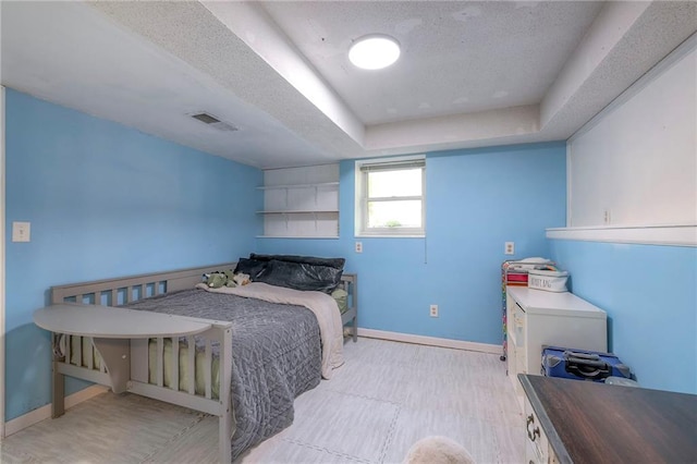 14001 S Tomahawk Dr, Olathe, KS 66062 - bedroom with a textured ceiling and a raised ceiling