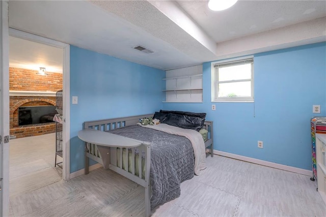 14001 S Tomahawk Dr, Olathe, KS 66062 - bedroom with a fireplace and a textured ceiling